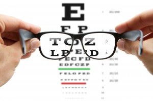 Looking through the glasses at eye chart