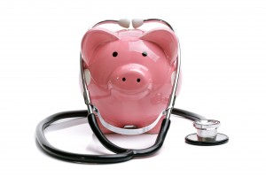 piggy bank with stethoscope